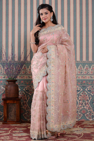 Shop light pink embroidered organza sari online in USA with scalloped border. Make a fashion statement at weddings with stunning designer sarees, embroidered sarees with blouse, wedding sarees, handloom sarees from Pure Elegance Indian fashion store in USA.-front