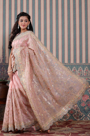 Shop light pink embroidered organza sari online in USA with scalloped border. Make a fashion statement at weddings with stunning designer sarees, embroidered sarees with blouse, wedding sarees, handloom sarees from Pure Elegance Indian fashion store in USA.-saree