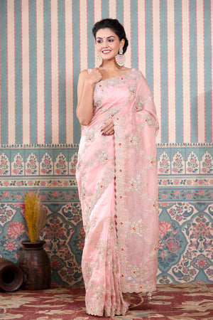 Buy stunning light pink embroidered organza sari online in USA. Make a fashion statement at weddings with stunning designer sarees, embroidered sarees with blouse, wedding sarees, handloom sarees from Pure Elegance Indian fashion store in USA.-front