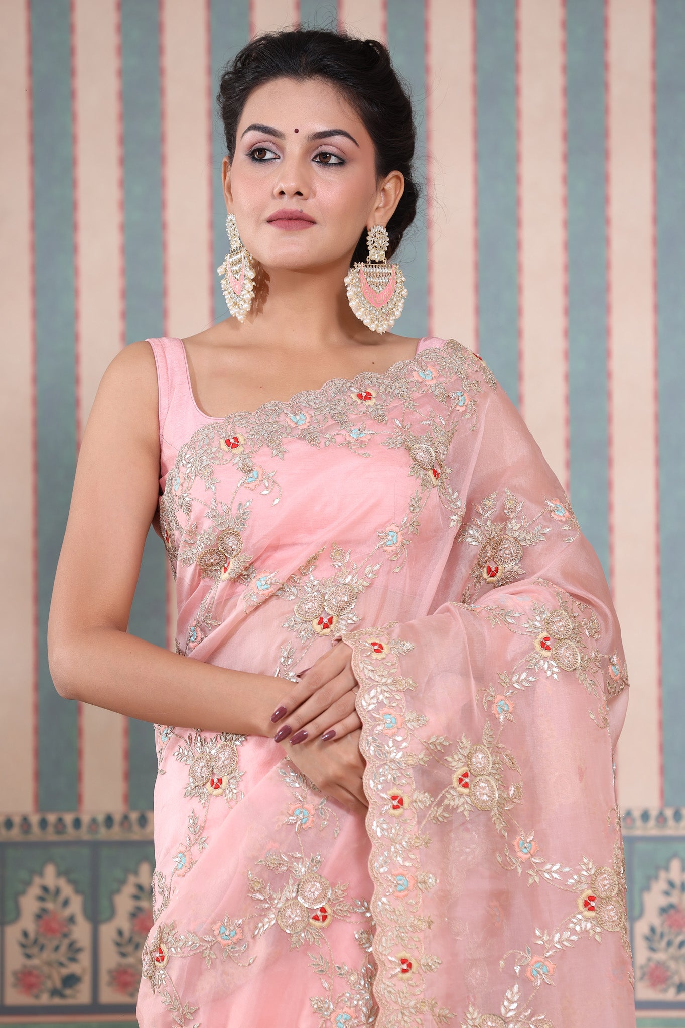 Buy stunning light pink embroidered organza sari online in USA. Make a fashion statement at weddings with stunning designer sarees, embroidered sarees with blouse, wedding sarees, handloom sarees from Pure Elegance Indian fashion store in USA.-closeup