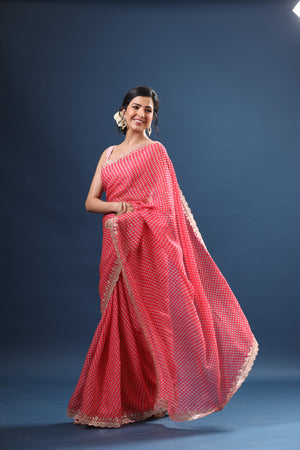 Shop pink printed organza sari online in USA with embroidered border. Make a fashion statement at weddings with stunning designer sarees, embroidered sarees with blouse, wedding sarees, handloom sarees from Pure Elegance Indian fashion store in USA.-pallu