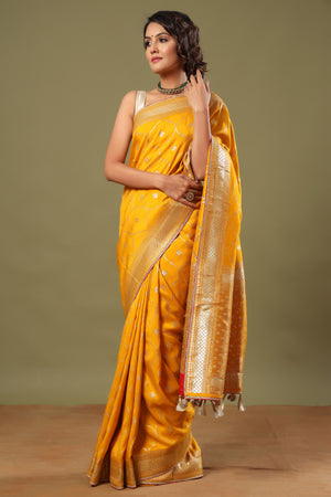 Buy stunning mango yellow Banarasi sari online in USA with zari jaal. Make a fashion statement at weddings with stunning designer sarees, embroidered sarees with blouse, wedding sarees, handloom sarees from Pure Elegance Indian fashion store in USA.-saree