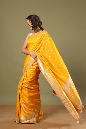 Buy stunning mango yellow Banarasi sari online in USA with zari jaal. Make a fashion statement at weddings with stunning designer sarees, embroidered sarees with blouse, wedding sarees, handloom sarees from Pure Elegance Indian fashion store in USA.-pallu