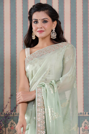 Shop beautiful pastel green embroidered organza silk sari online in USA. Make a fashion statement at weddings with stunning designer sarees, embroidered sarees with blouse, wedding sarees, handloom sarees from Pure Elegance Indian fashion store in USA.-embroidery