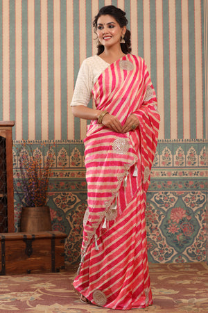 Shop pink striped tussar silk sari online in USA with saree blouse.. Make a fashion statement at weddings with stunning designer sarees, embroidered sarees with blouse, wedding sarees, handloom sarees from Pure Elegance Indian fashion store in USA.-side