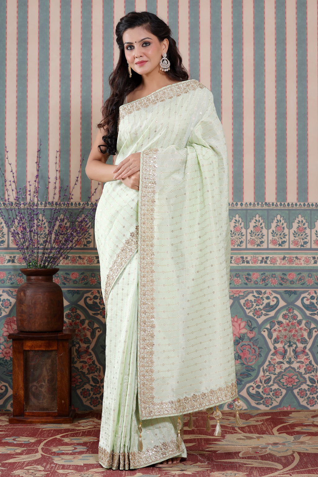 Buy mint green organza silk sari online in USA with embroidered border. Make a fashion statement at weddings with stunning designer sarees, embroidered sarees with blouse, wedding sarees, handloom sarees from Pure Elegance Indian fashion store in USA.-full view
