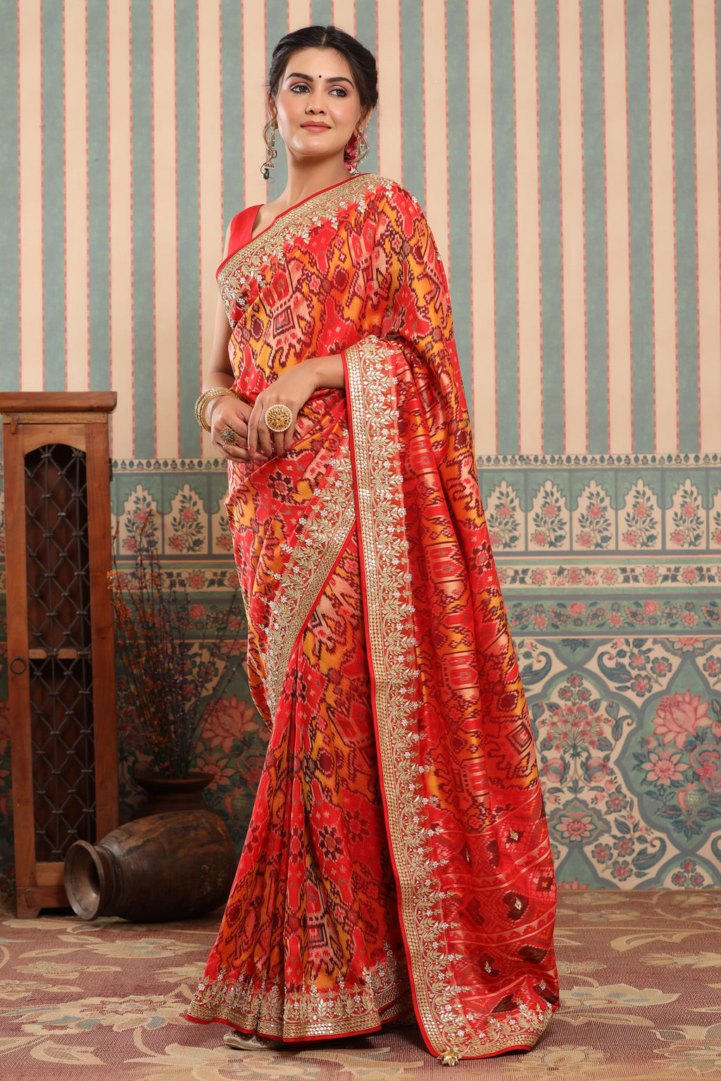 Buy orange Patola silk sari online in USA with embroidered zari border. Make a fashion statement at weddings with stunning designer sarees, embroidered sarees with blouse, wedding sarees, handloom sarees from Pure Elegance Indian fashion store in USA.-full view