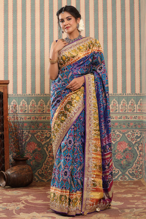 Shop blue Patola silk sari online in USA with embroidered zari border. Make a fashion statement at weddings with stunning designer sarees, embroidered sarees with blouse, wedding sarees, handloom sarees from Pure Elegance Indian fashion store in USA.-front