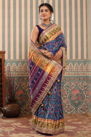 Shop blue Patola silk sari online in USA with embroidered zari border. Make a fashion statement at weddings with stunning designer sarees, embroidered sarees with blouse, wedding sarees, handloom sarees from Pure Elegance Indian fashion store in USA.-side