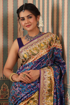 Shop blue Patola silk sari online in USA with embroidered zari border. Make a fashion statement at weddings with stunning designer sarees, embroidered sarees with blouse, wedding sarees, handloom sarees from Pure Elegance Indian fashion store in USA.-closeup