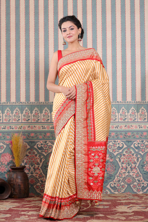 Buy mustard and cream Patola silk sari online in USA with embroidered border. Make a fashion statement at weddings with stunning designer sarees, embroidered sarees with blouse, wedding sarees, handloom sarees from Pure Elegance Indian fashion store in USA.-saree