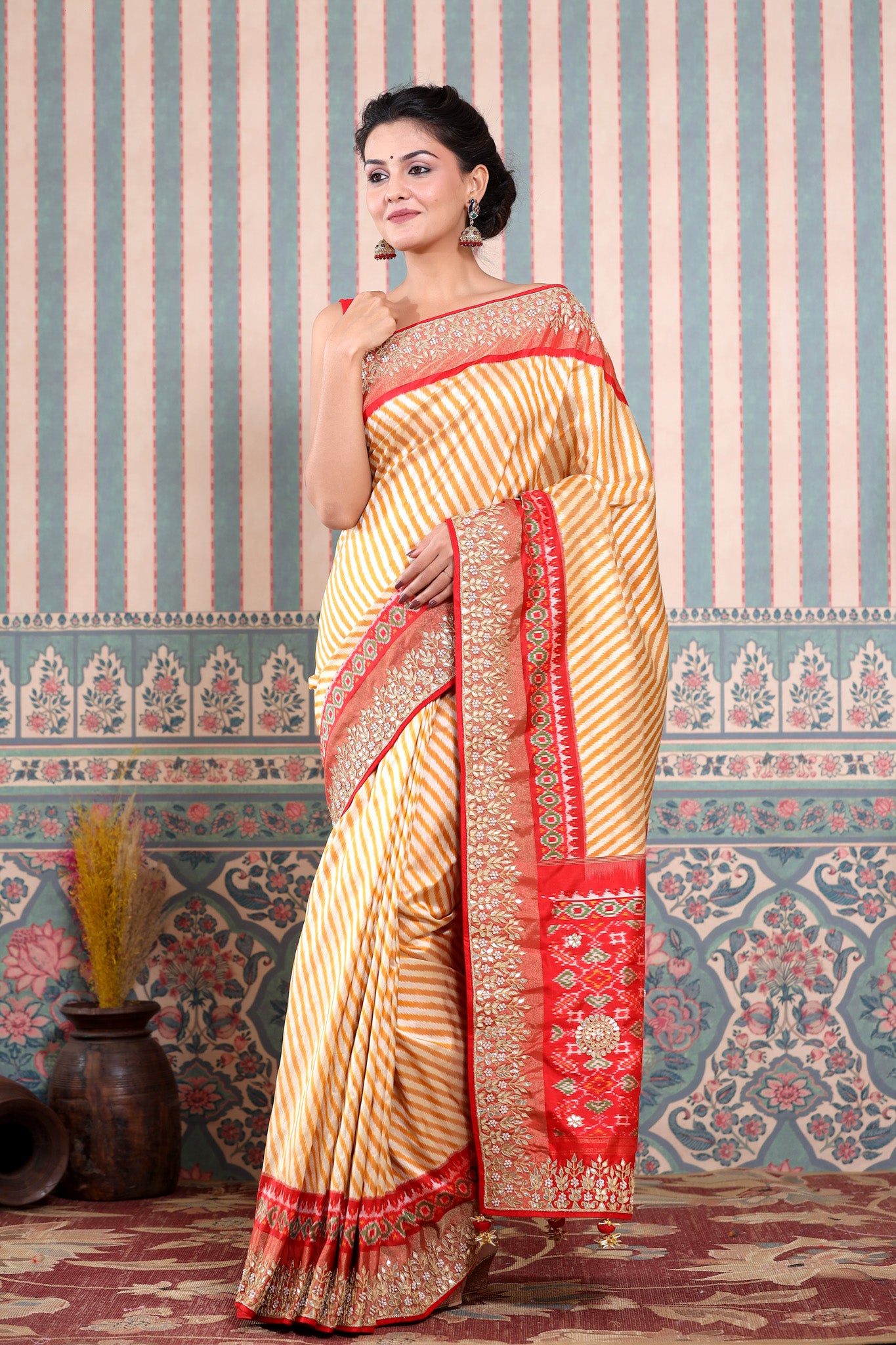 Buy mustard and cream Patola silk sari online in USA with embroidered border. Make a fashion statement at weddings with stunning designer sarees, embroidered sarees with blouse, wedding sarees, handloom sarees from Pure Elegance Indian fashion store in USA.-front