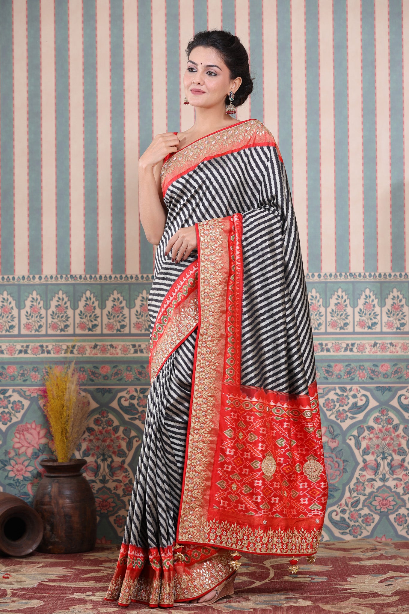 Buy black and grey Patola silk sari online in USA with embroidered border. Make a fashion statement at weddings with stunning designer sarees, embroidered sarees with blouse, wedding sarees, handloom sarees from Pure Elegance Indian fashion store in USA.-saree