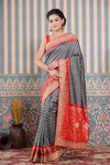 Buy black and grey Patola silk sari online in USA with embroidered border. Make a fashion statement at weddings with stunning designer sarees, embroidered sarees with blouse, wedding sarees, handloom sarees from Pure Elegance Indian fashion store in USA.-full view