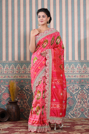 Buy pink Patola silk sari online in USA with embroidered scalloped border. Make a fashion statement at weddings with stunning designer sarees, embroidered sarees with blouse, wedding sarees, handloom sarees from Pure Elegance Indian fashion store in USA.-saree