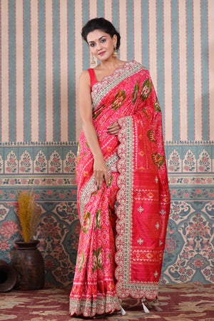 Buy pink Patola silk sari online in USA with embroidered scalloped border. Make a fashion statement at weddings with stunning designer sarees, embroidered sarees with blouse, wedding sarees, handloom sarees from Pure Elegance Indian fashion store in USA.-front