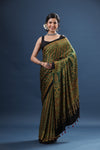 Shop elegant mehendi green printed modal silk sari online in USA. Make a fashion statement at weddings with stunning designer sarees, embroidered sarees with blouse, wedding sarees, handloom sarees from Pure Elegance Indian fashion store in USA.-full view