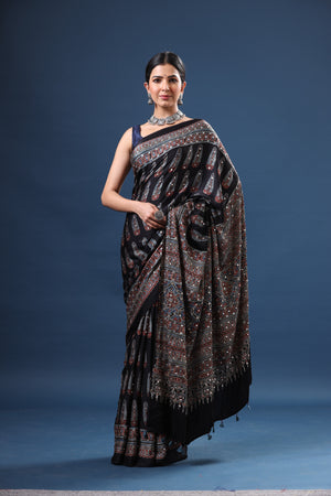 Shop stunning black printed modal silk sari online in USA. Make a fashion statement at weddings with stunning designer sarees, embroidered sarees with blouse, wedding sarees, handloom sarees from Pure Elegance Indian fashion store in USA.-front