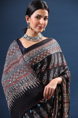 Shop stunning black printed modal silk sari online in USA. Make a fashion statement at weddings with stunning designer sarees, embroidered sarees with blouse, wedding sarees, handloom sarees from Pure Elegance Indian fashion store in USA.-closeup