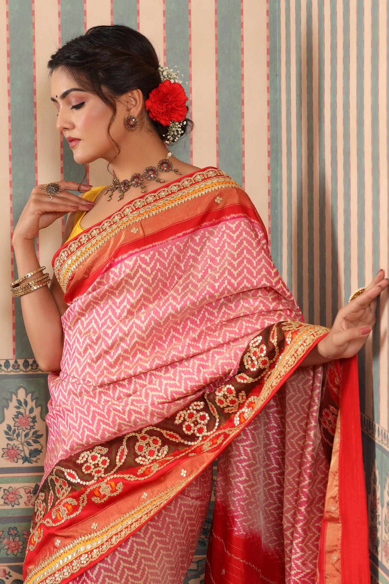 Shop pink Patola silk sari online in USA with embroidered border. Make a fashion statement at weddings with stunning designer sarees, embroidered sarees with blouse, wedding sarees, handloom sarees from Pure Elegance Indian fashion store in USA.-closeup