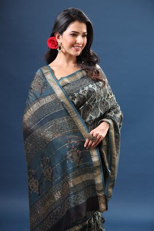 Buy blue printed tussar silk silk sari online in USA with zari border. Make a fashion statement at weddings with stunning designer sarees, embroidered sarees with blouse, wedding sarees, handloom sarees from Pure Elegance Indian fashion store in USA.-closeup
