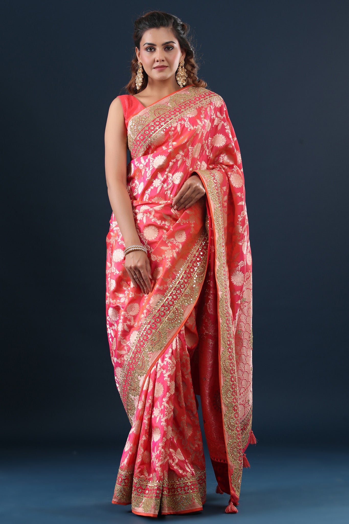 Buy peachish pink Banarasi silk sari online in USA with embroidered border. Make a fashion statement at weddings with stunning designer sarees, embroidered sarees with blouse, wedding sarees, handloom sarees from Pure Elegance Indian fashion store in USA.-front
