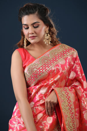 Buy peachish pink Banarasi silk sari online in USA with embroidered border. Make a fashion statement at weddings with stunning designer sarees, embroidered sarees with blouse, wedding sarees, handloom sarees from Pure Elegance Indian fashion store in USA.-closeup