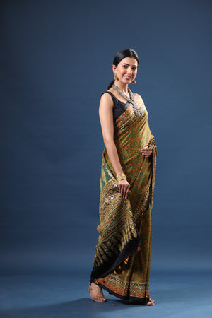 Buy beautiful mehendi green Ajrakh print modal silk sari online in USA. Make a fashion statement at weddings with stunning designer sarees, embroidered sarees with blouse, wedding sarees, handloom sarees from Pure Elegance Indian fashion store in USA.-side