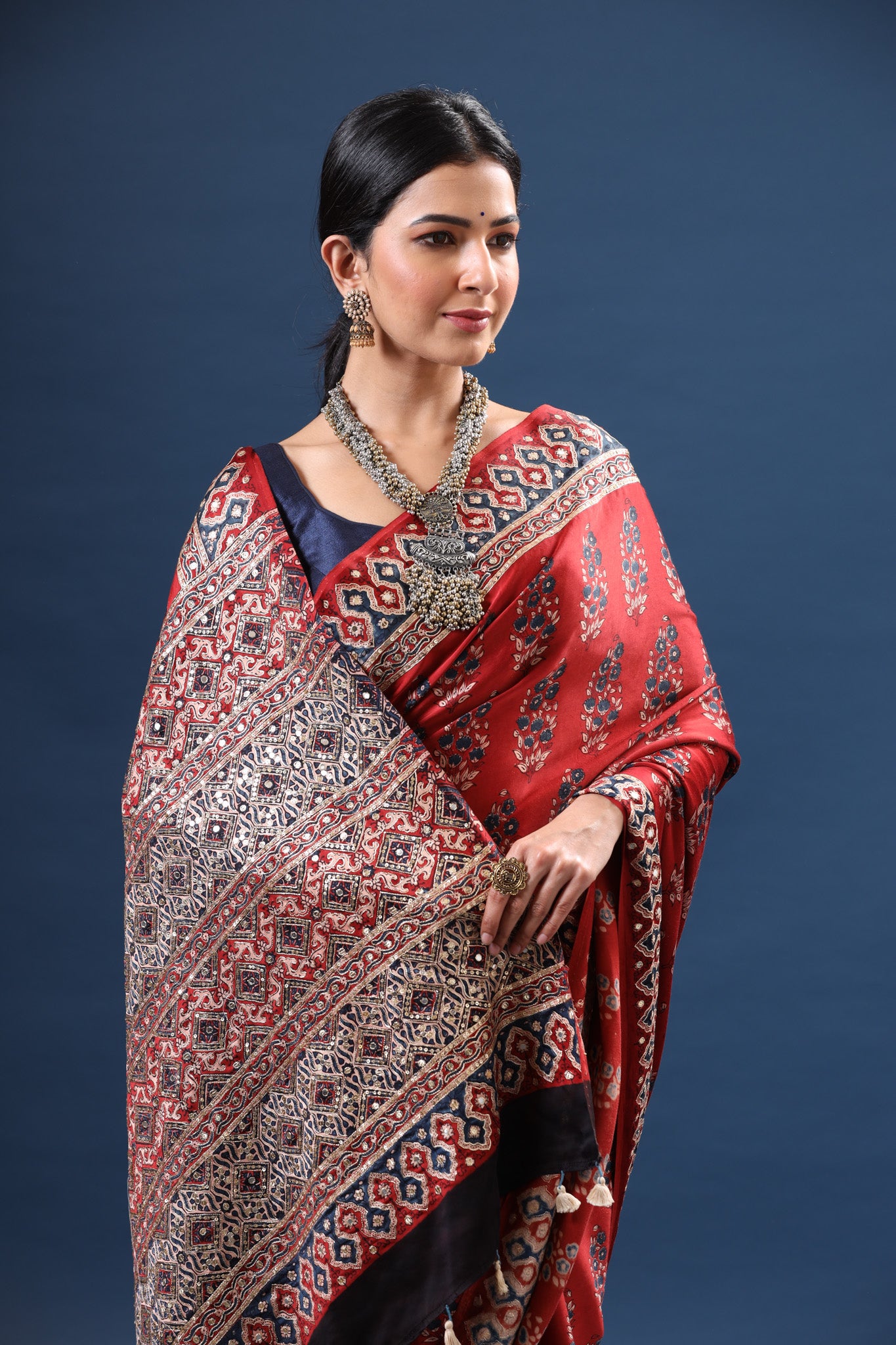 Shop stunning red Ajrakh print modal silk sari online in USA. Make a fashion statement at weddings with stunning designer sarees, embroidered sarees with blouse, wedding sarees, handloom sarees from Pure Elegance Indian fashion store in USA.-closeup