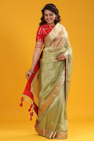 Shop pista green embroidered organza Banarasi sari online in USA with zari border. Make a fashion statement at weddings with stunning designer sarees, embroidered sarees with blouse, wedding sarees, handloom sarees from Pure Elegance Indian fashion store in USA.-side