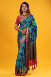 Buy green and blue Banarasi silk sari online in USA with zari border. Make a fashion statement at weddings with stunning designer sarees, embroidered sarees with blouse, wedding sarees, handloom sarees from Pure Elegance Indian fashion store in USA.-full view