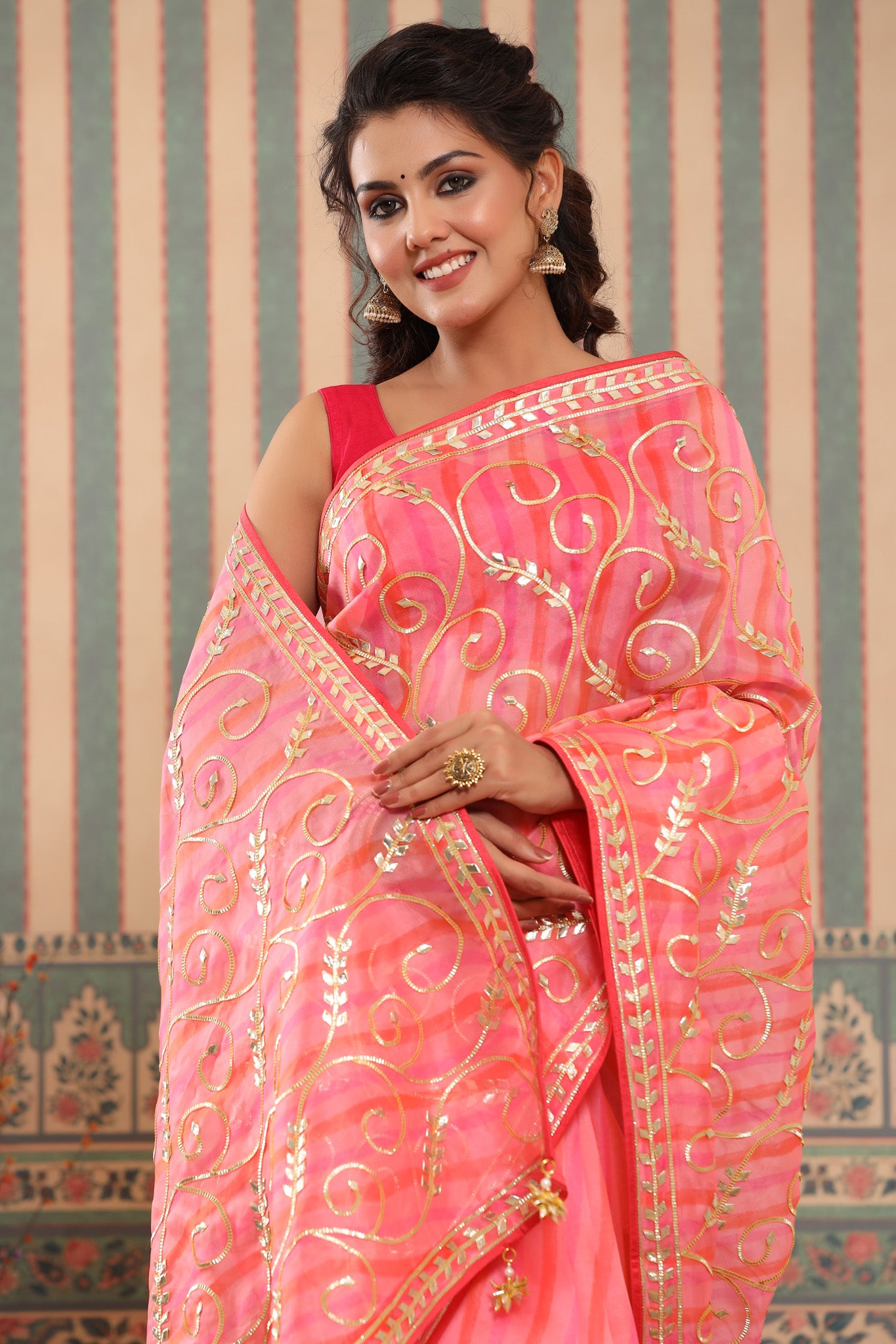 Buy pink and orange organza sari online in USA with gota work. Make a fashion statement at weddings with stunning designer sarees, embroidered sarees with blouse, wedding sarees, handloom sarees from Pure Elegance Indian fashion store in USA.-closeup