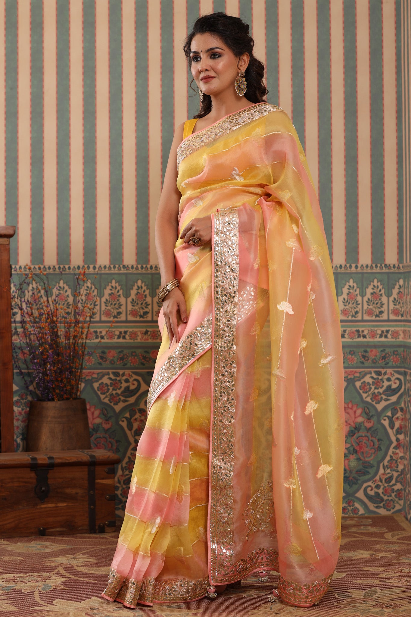 Shop beautiful yellow and peach organza sari online in USA with gota patti border. Make a fashion statement at weddings with stunning designer sarees, embroidered sarees with blouse, wedding sarees, handloom sarees from Pure Elegance Indian fashion store in USA.-pallu