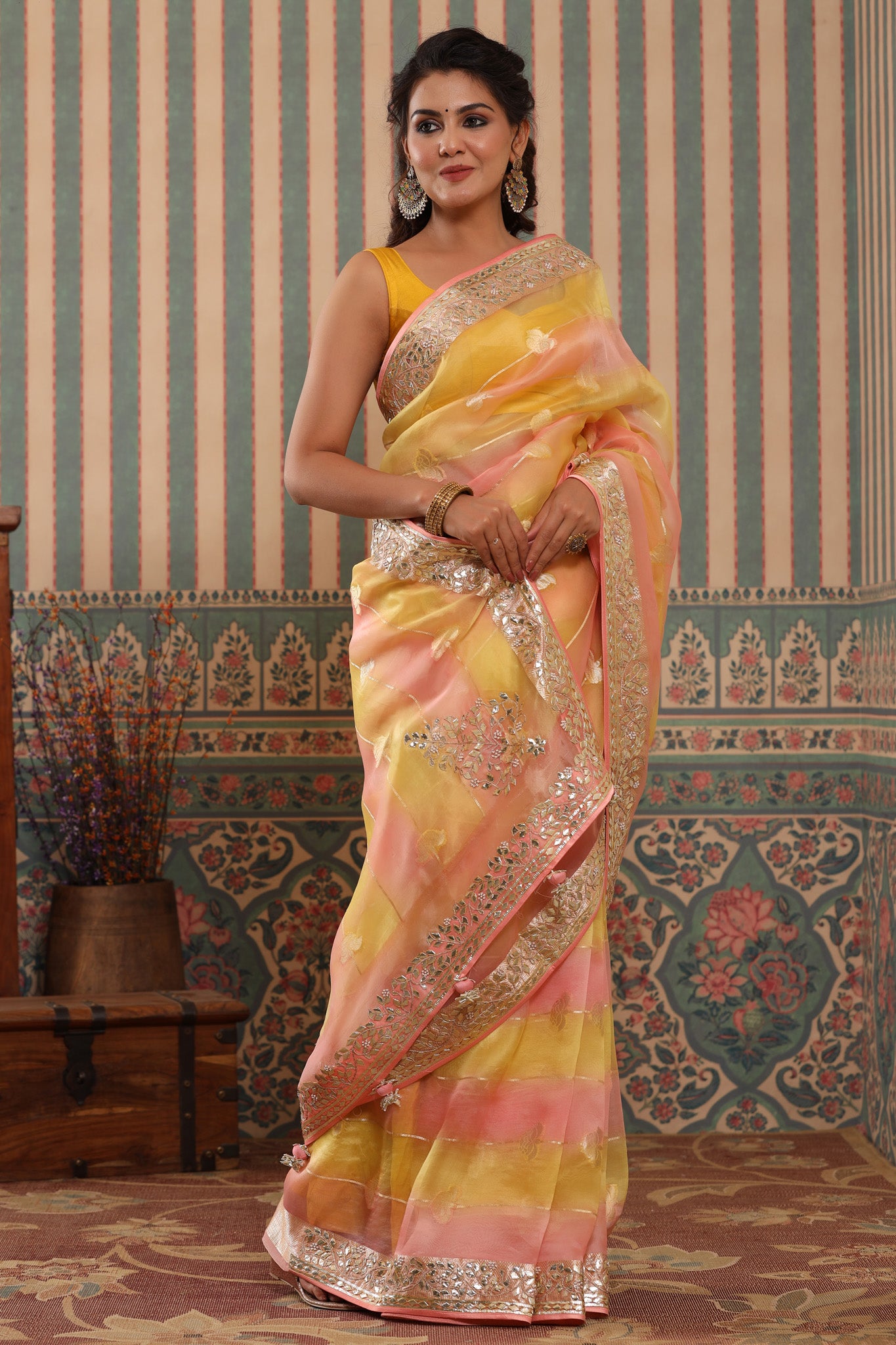 Shop beautiful yellow and peach organza sari online in USA with gota patti border. Make a fashion statement at weddings with stunning designer sarees, embroidered sarees with blouse, wedding sarees, handloom sarees from Pure Elegance Indian fashion store in USA.-pallu