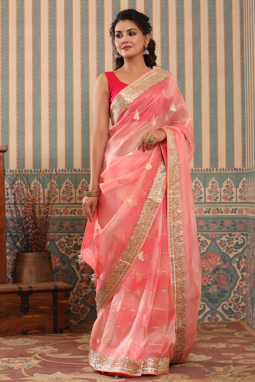 Buy pink organza sari online in USA with gota patti border. Make a fashion statement at weddings with stunning designer sarees, embroidered sarees with blouse, wedding sarees, handloom sarees from Pure Elegance Indian fashion store in USA.-full view