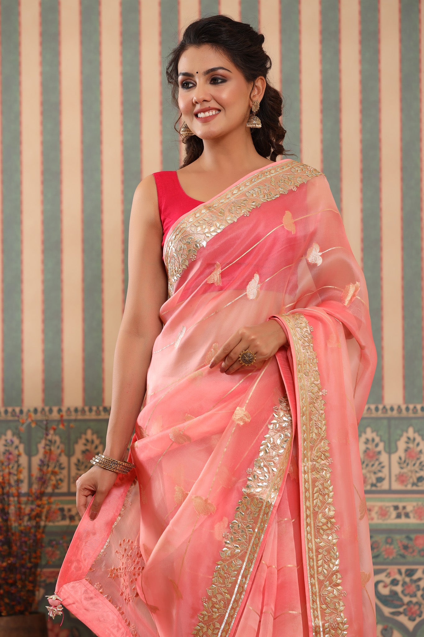 Buy pink organza sari online in USA with gota patti border. Make a fashion statement at weddings with stunning designer sarees, embroidered sarees with blouse, wedding sarees, handloom sarees from Pure Elegance Indian fashion store in USA.-closeup