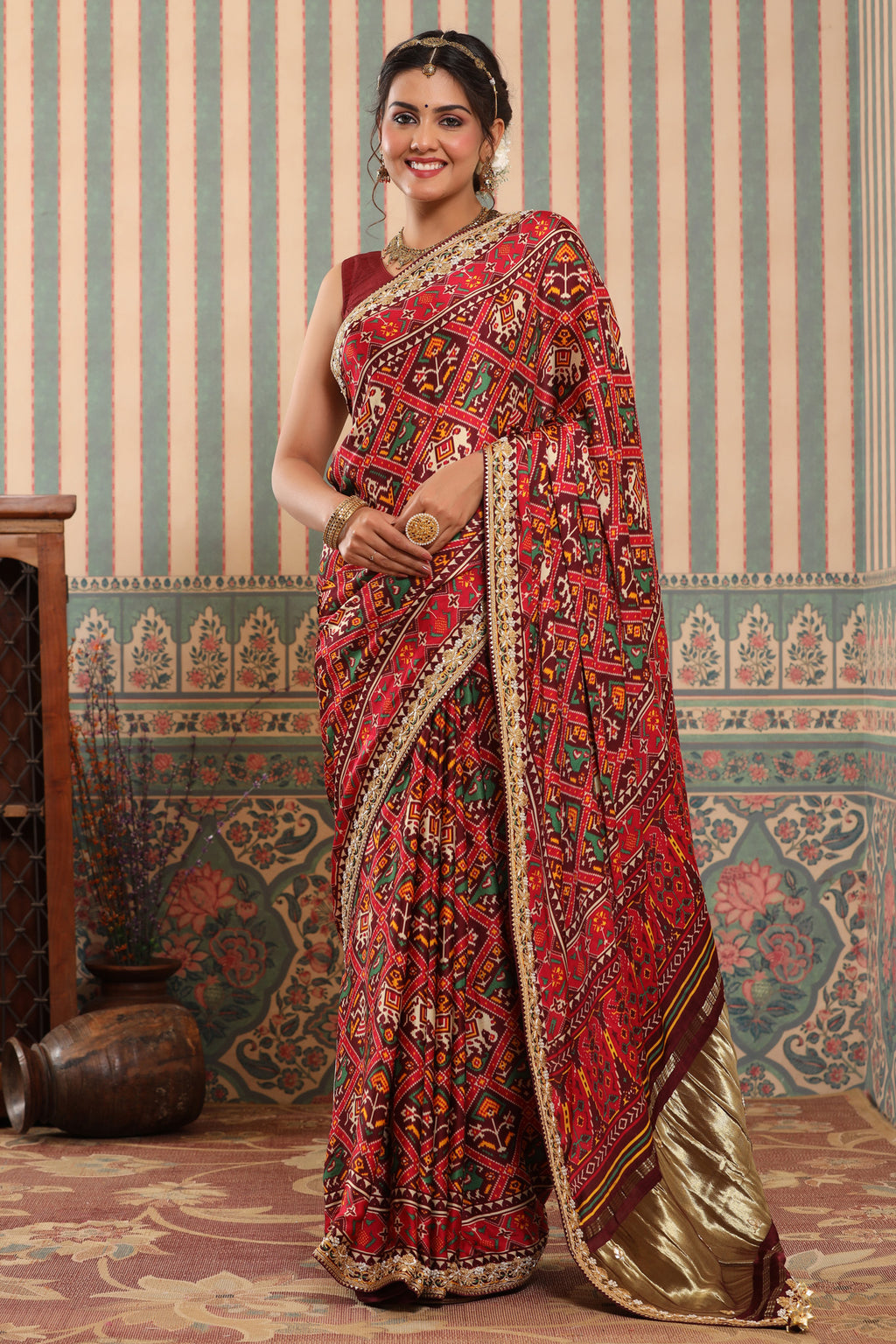 Shop red Patola sari online in USA with embroidered border. Make a fashion statement at weddings with stunning designer sarees, embroidered sarees with blouse, wedding sarees, handloom sarees from Pure Elegance Indian fashion store in USA.-full view