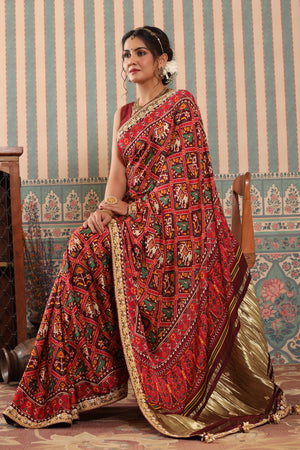 Shop red Patola sari online in USA with embroidered border. Make a fashion statement at weddings with stunning designer sarees, embroidered sarees with blouse, wedding sarees, handloom sarees from Pure Elegance Indian fashion store in USA.-saree