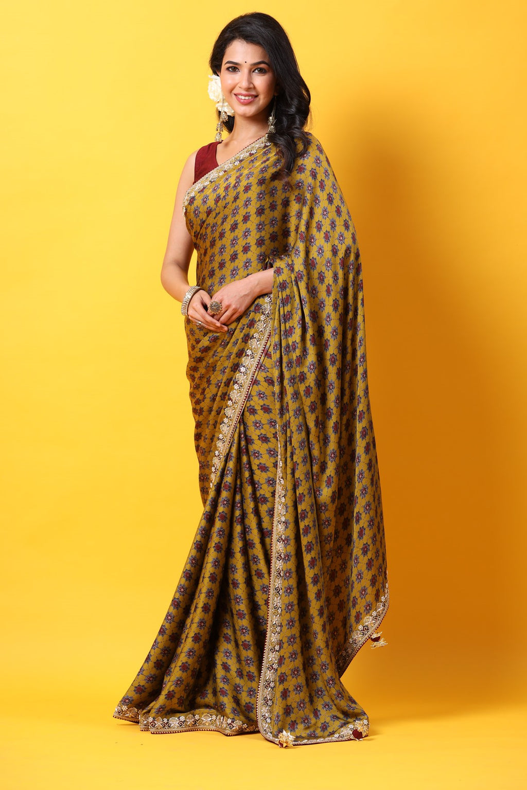 Buy mustard printed georgette sari online in USA with embroidered lace border. Make a fashion statement at weddings with stunning designer sarees, embroidered sarees with blouse, wedding sarees, handloom sarees from Pure Elegance Indian fashion store in USA.-full view