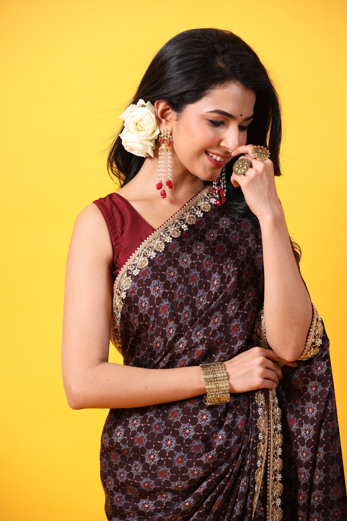Shop brown printed georgette sari online in USA with lace border. Make a fashion statement at weddings with stunning designer sarees, embroidered sarees with blouse, wedding sarees, handloom sarees from Pure Elegance Indian fashion store in USA.-closeup