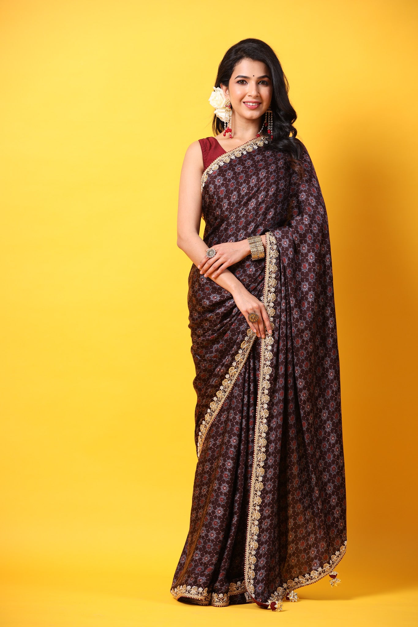 Shop brown printed georgette sari online in USA with lace border. Make a fashion statement at weddings with stunning designer sarees, embroidered sarees with blouse, wedding sarees, handloom sarees from Pure Elegance Indian fashion store in USA.-front