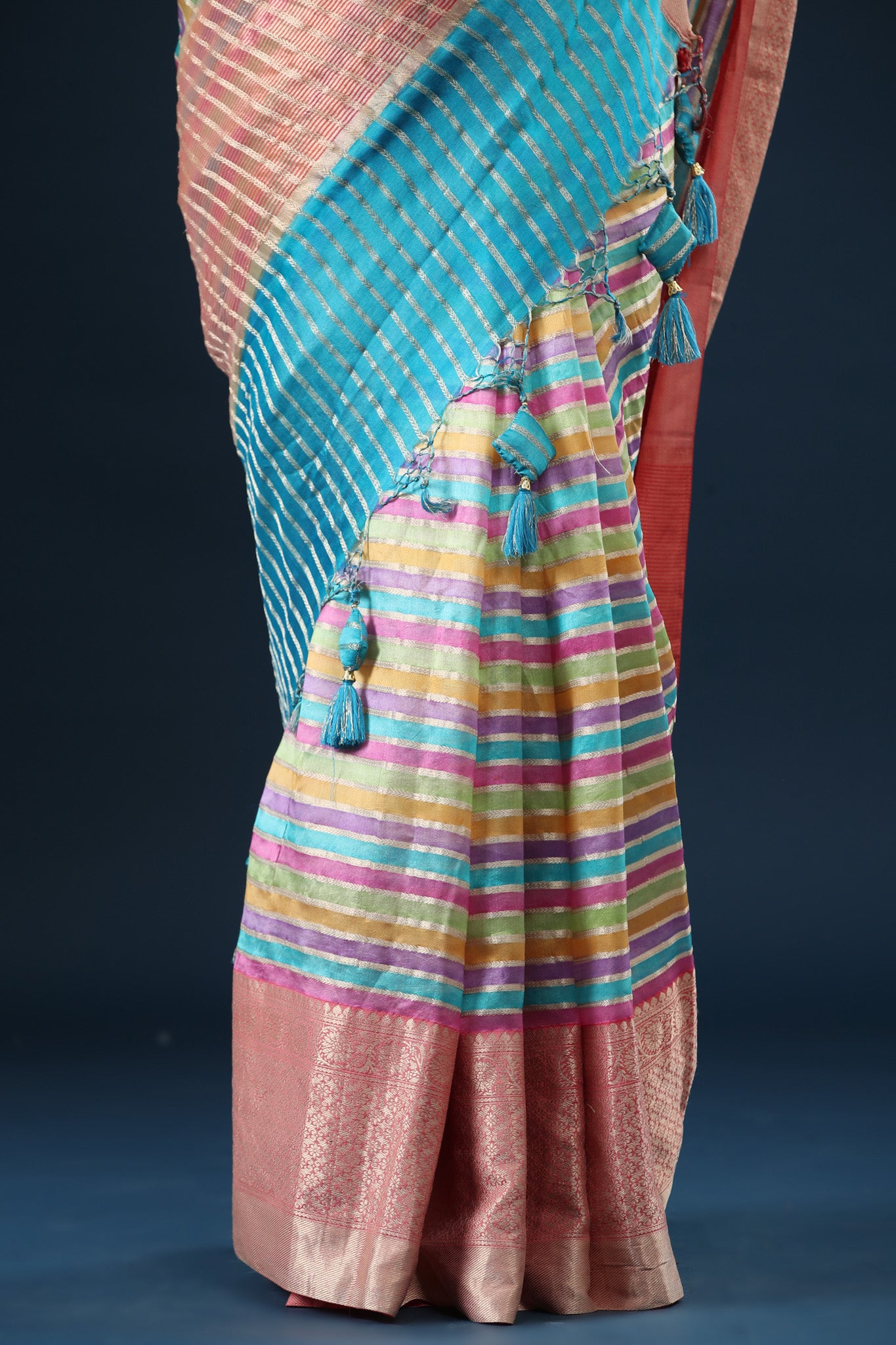 Shop pastel multicolor stripes linen sari online in USA with zari border. Make a fashion statement at weddings with stunning designer sarees, embroidered sarees with blouse, wedding sarees, handloom sarees from Pure Elegance Indian fashion store in USA.-pleats