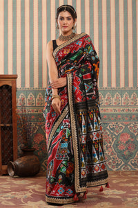 Buy black multicolor Patola sari online in USA with embroidered border. Make a fashion statement at weddings with stunning designer sarees, embroidered sarees with blouse, wedding sarees, handloom sarees from Pure Elegance Indian fashion store in USA.-full view