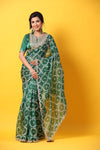 Buy green printed organza sari online in USA with embroidered scalloped border. Make a fashion statement at weddings with stunning designer sarees, embroidered sarees with blouse, wedding sarees, handloom sarees from Pure Elegance Indian fashion store in USA.-full view