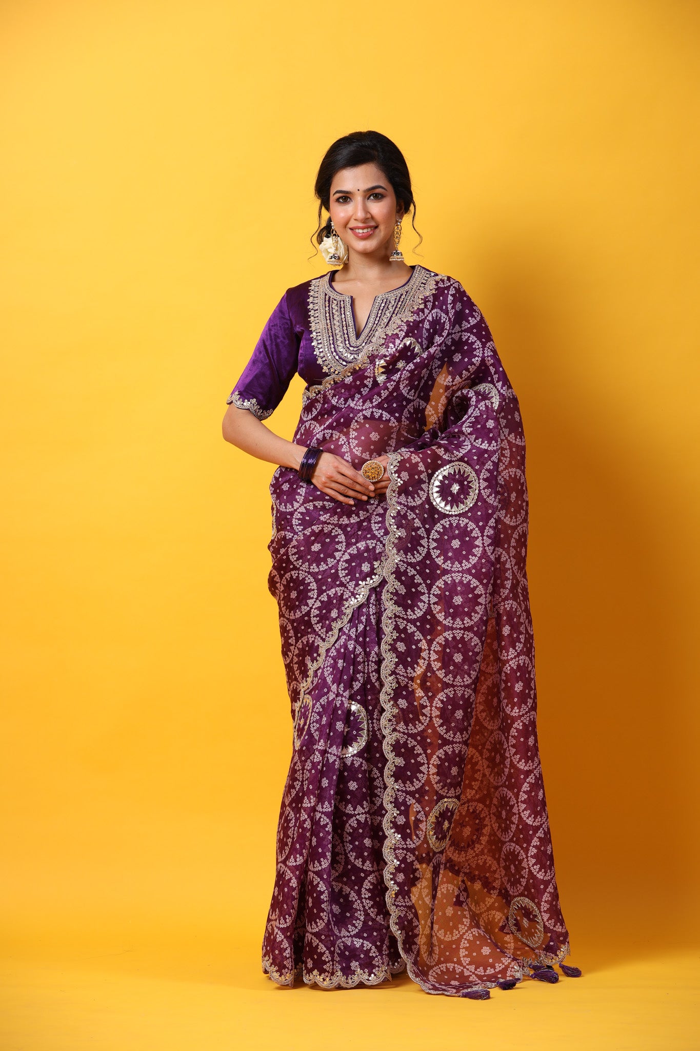 Shop purple printed organza sari online in USA with embroidered scalloped border. Make a fashion statement at weddings with stunning designer sarees, embroidered sarees with blouse, wedding sarees, handloom sarees from Pure Elegance Indian fashion store in USA.-front