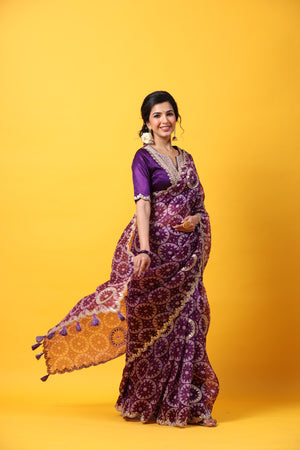 Shop purple printed organza sari online in USA with embroidered scalloped border. Make a fashion statement at weddings with stunning designer sarees, embroidered sarees with blouse, wedding sarees, handloom sarees from Pure Elegance Indian fashion store in USA.-side