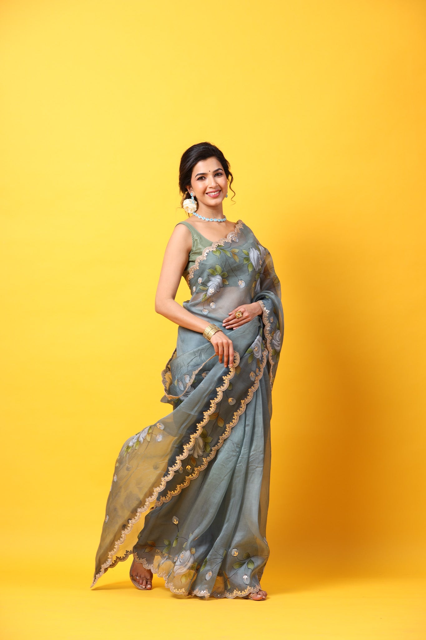 Buy beautiful grey hand painted organza sari online in USA with embroidered scalloped border. Make a fashion statement at weddings with stunning designer sarees, embroidered sarees with blouse, wedding sarees, handloom sarees from Pure Elegance Indian fashion store in USA.-side