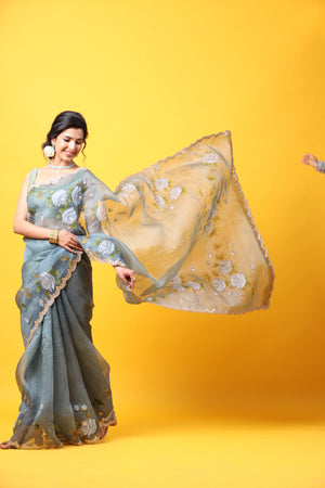 Buy beautiful grey hand painted organza sari online in USA with embroidered scalloped border. Make a fashion statement at weddings with stunning designer sarees, embroidered sarees with blouse, wedding sarees, handloom sarees from Pure Elegance Indian fashion store in USA.-pallu