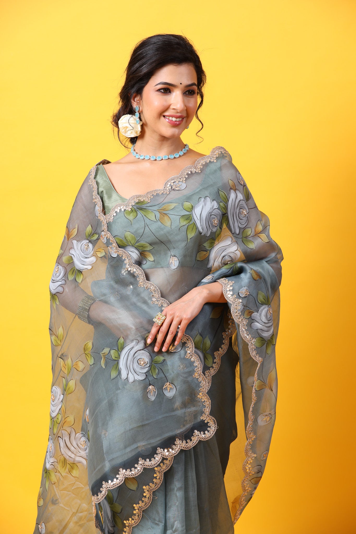 Buy beautiful grey hand painted organza sari online in USA with embroidered scalloped border. Make a fashion statement at weddings with stunning designer sarees, embroidered sarees with blouse, wedding sarees, handloom sarees from Pure Elegance Indian fashion store in USA.-closeup