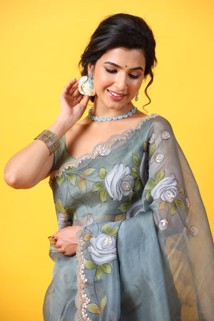 Buy beautiful grey hand painted organza sari online in USA with embroidered scalloped border. Make a fashion statement at weddings with stunning designer sarees, embroidered sarees with blouse, wedding sarees, handloom sarees from Pure Elegance Indian fashion store in USA.-saree